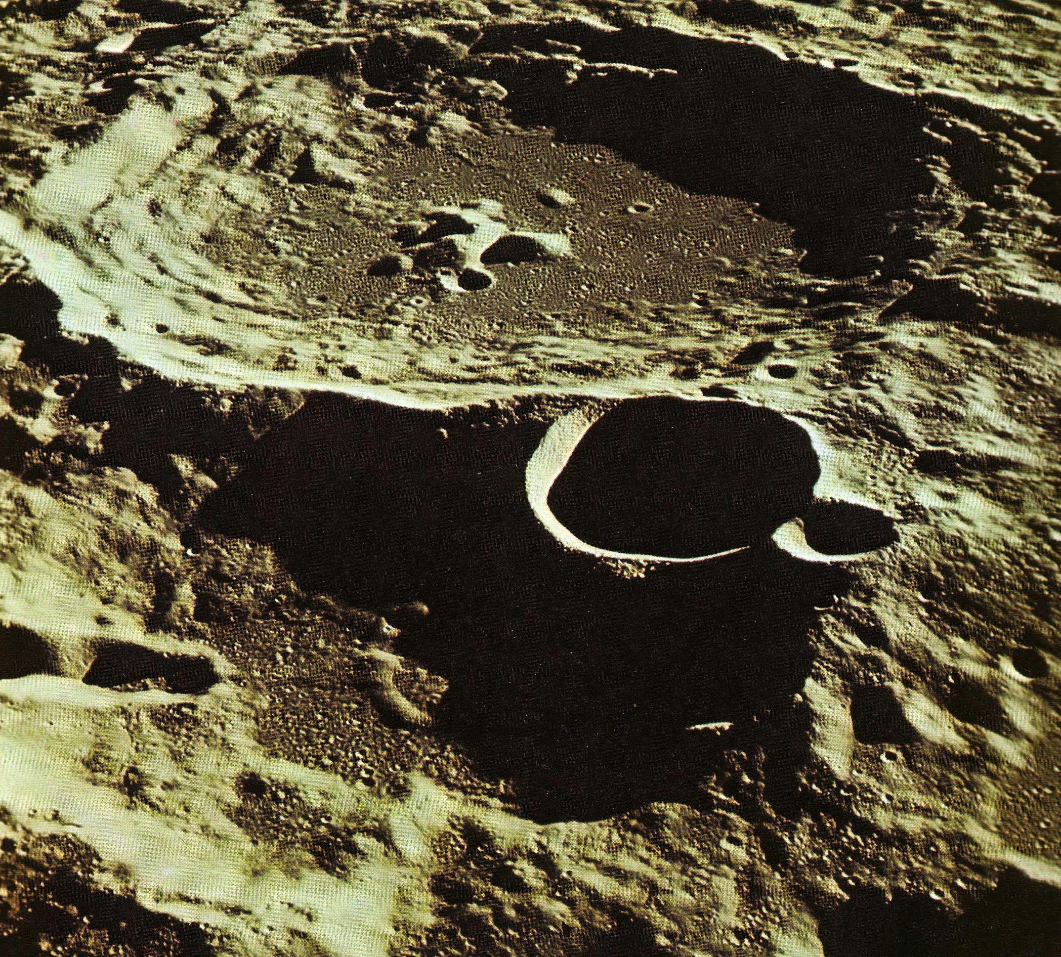 Figure 2: (P_Pa2_2) Photograph of craters of the moon, and map of the lunar terrain